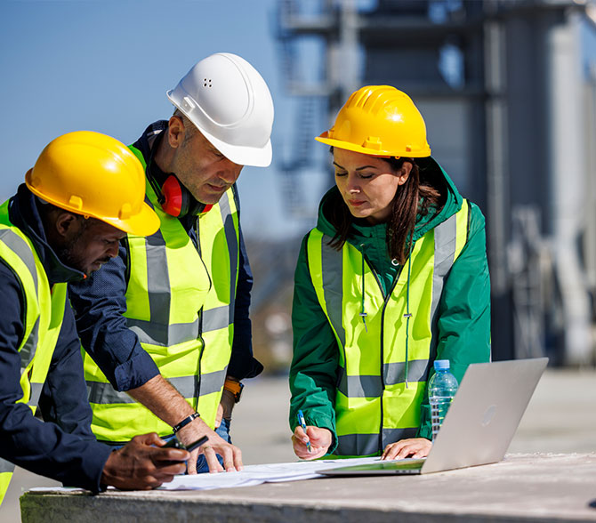 Construction crew looking at blueprints